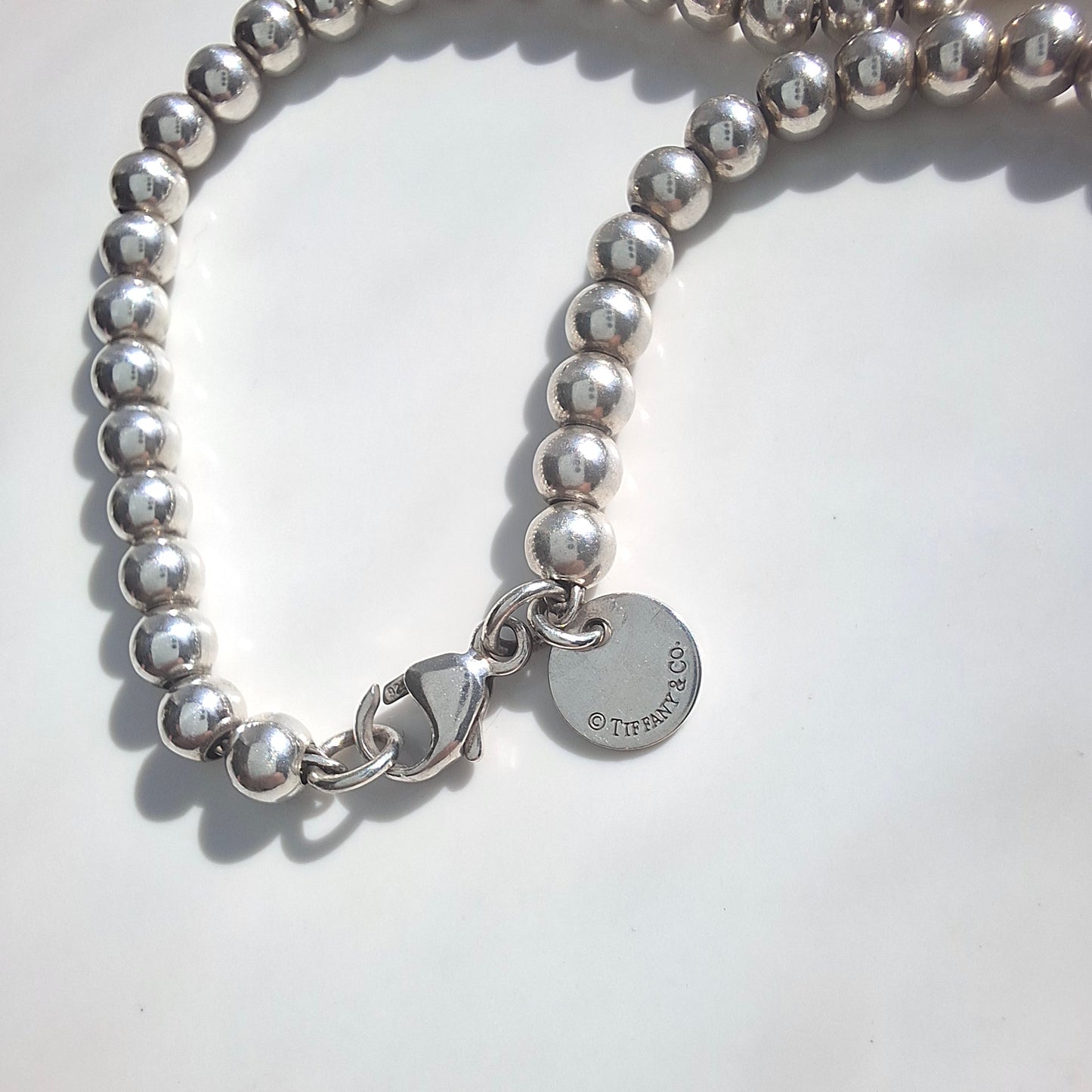 Return to Tiffany Sterling Silver Beaded Bracelet With Pink Enamel Heart Charm Tag
