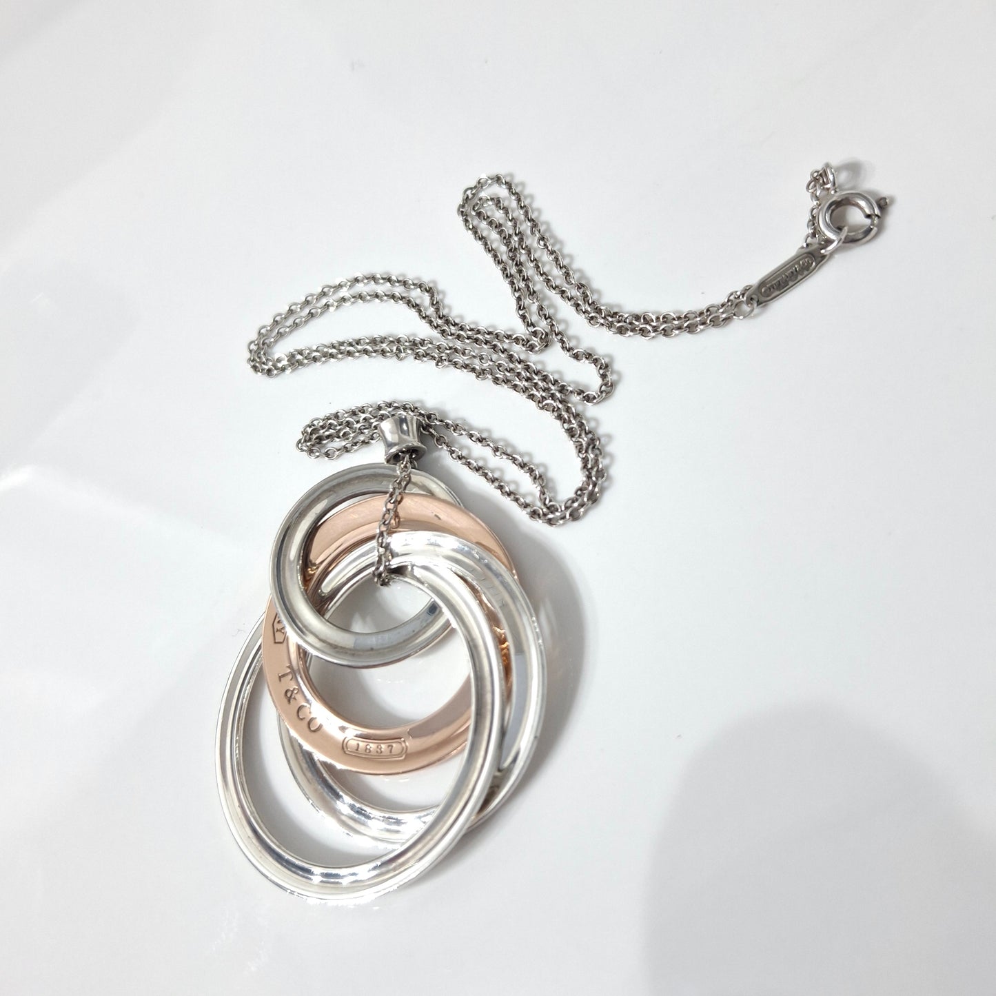 2012 Tiffany & Co 1837 Rubedo and Hallmarked 925 Sterling Silver Interlocking Circles Four Ring Pendant Necklace