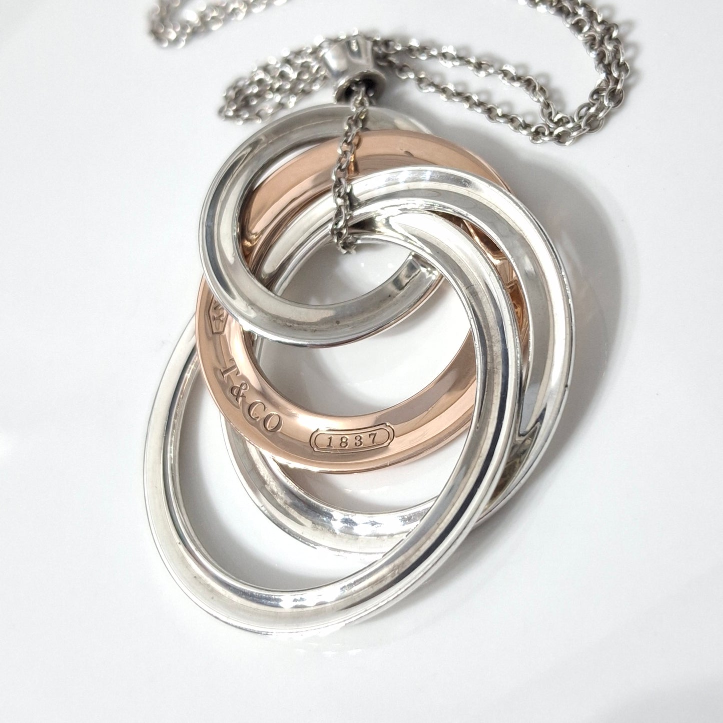 2012 Tiffany & Co 1837 Rubedo and Hallmarked 925 Sterling Silver Interlocking Circles Four Ring Pendant Necklace