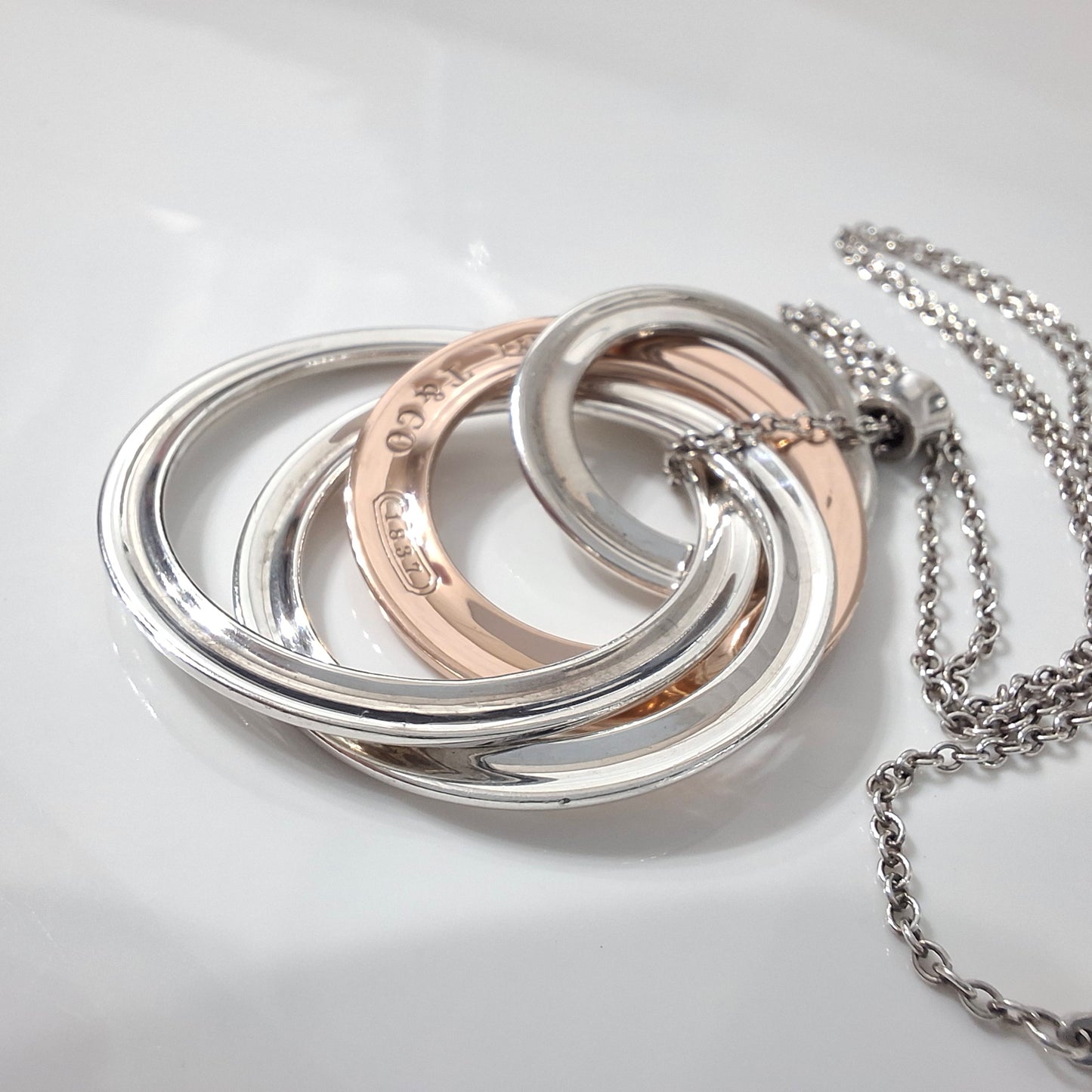 2012 Tiffany & Co 1837 Rubedo and Hallmarked 925 Sterling Silver Interlocking Circles Four Ring Pendant Necklace