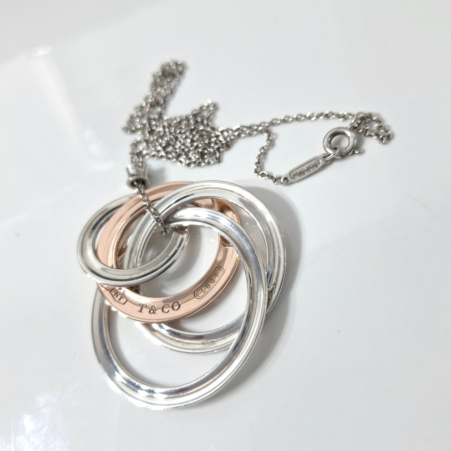 2012 Tiffany & Co 1837 Rubedo and Hallmarked 925 Sterling Silver Interlocking Circles Four Ring Pendant Necklace