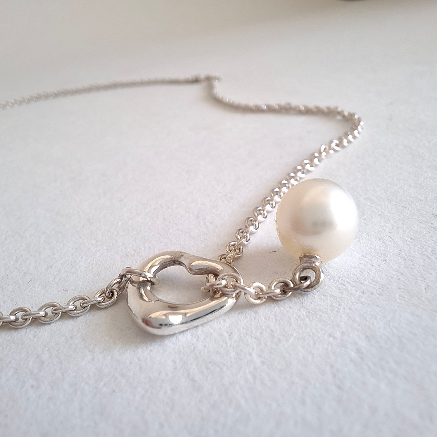 Tiffany & Co. Elsa Peretti Design Open Heart Lariat Necklace in Silver with a Pearl