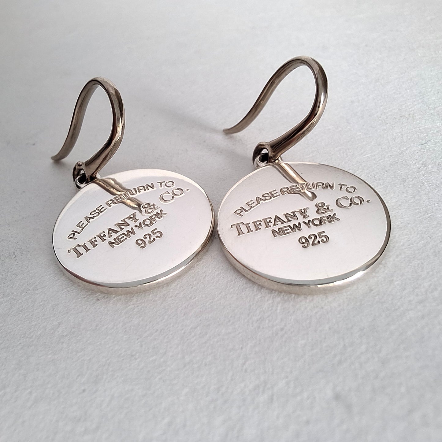 Return to Tiffany & Co Round Tag Charm Dangle Earrings in Sterling Silver