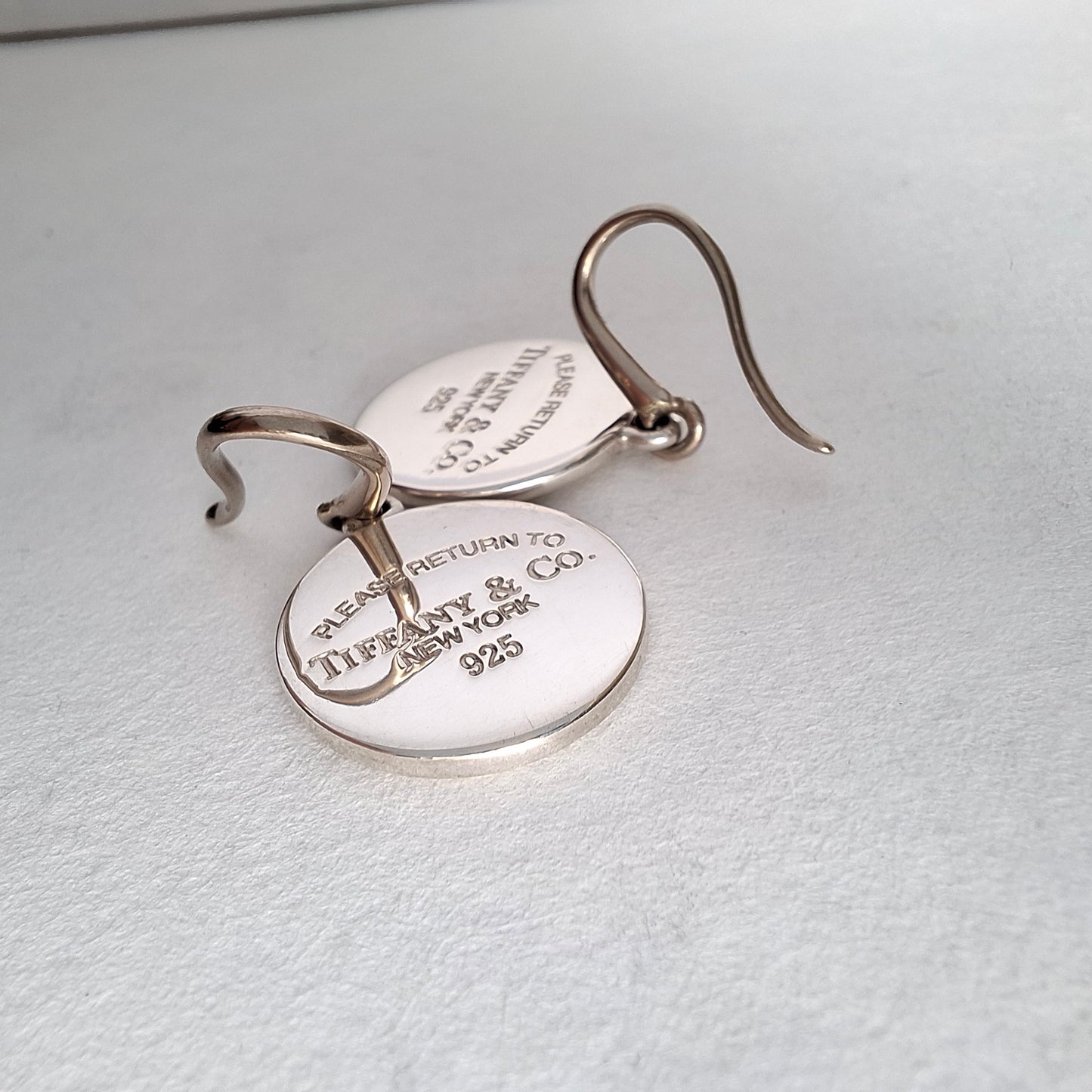 Return to Tiffany & Co Round Tag Charm Dangle Earrings in Sterling Silver