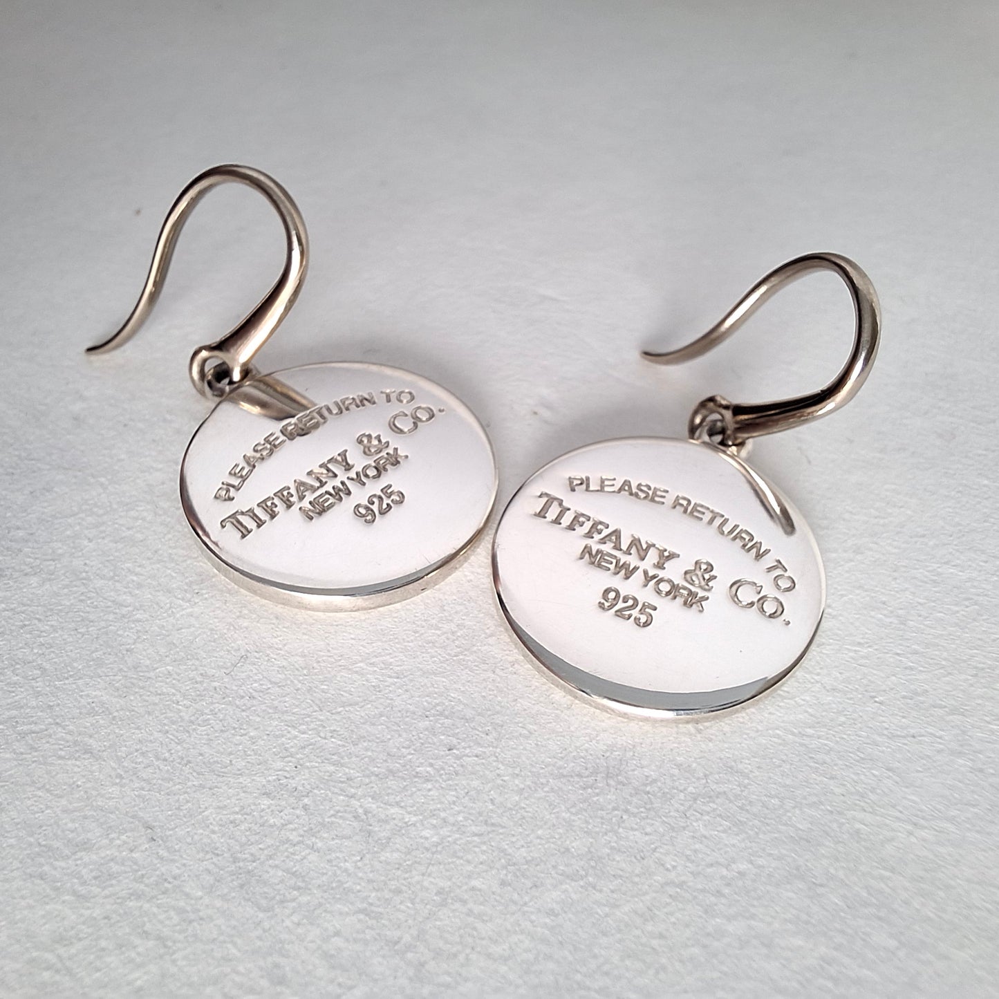 Return to Tiffany & Co Round Tag Charm Dangle Earrings in Sterling Silver