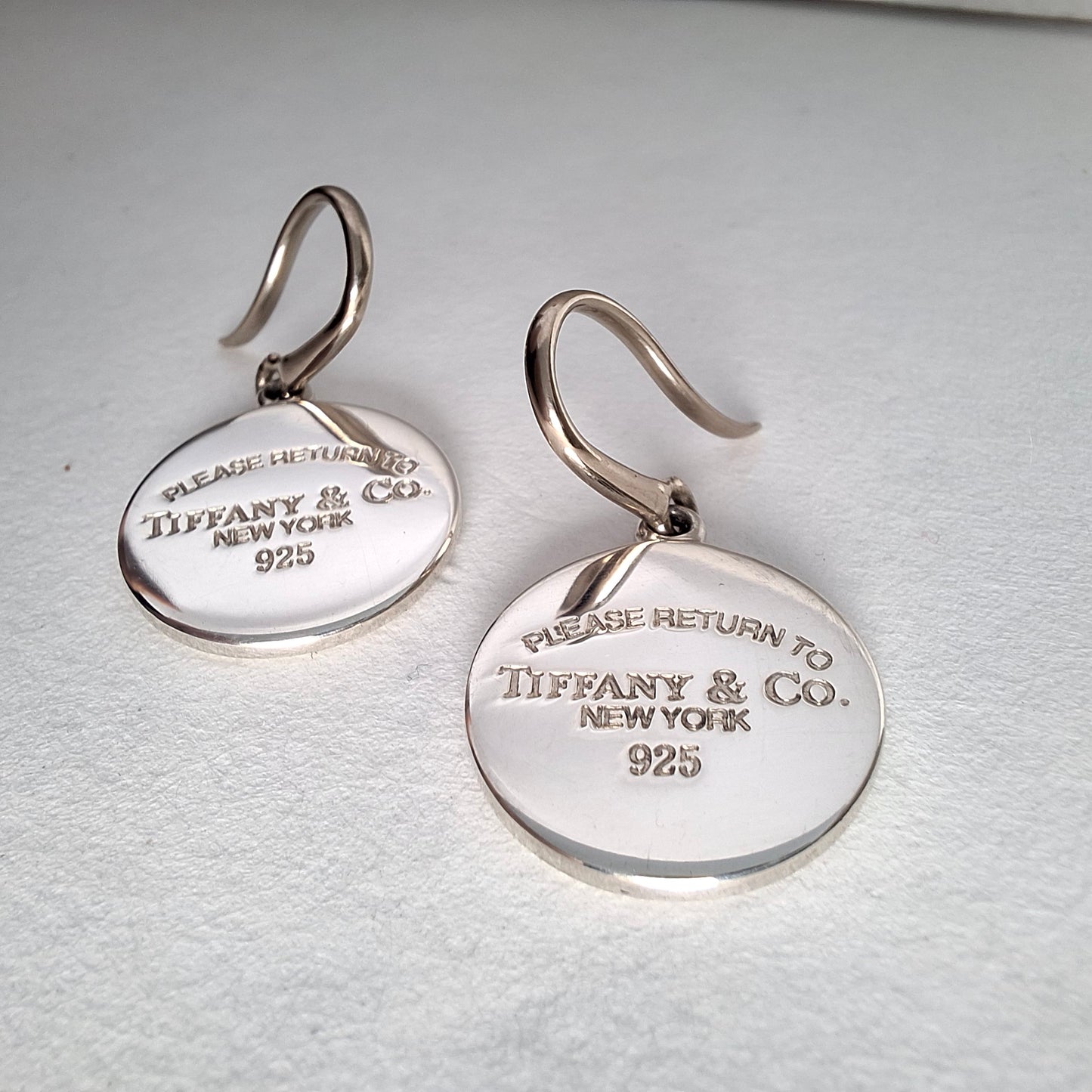 Return to Tiffany & Co Round Tag Charm Dangle Earrings in Sterling Silver