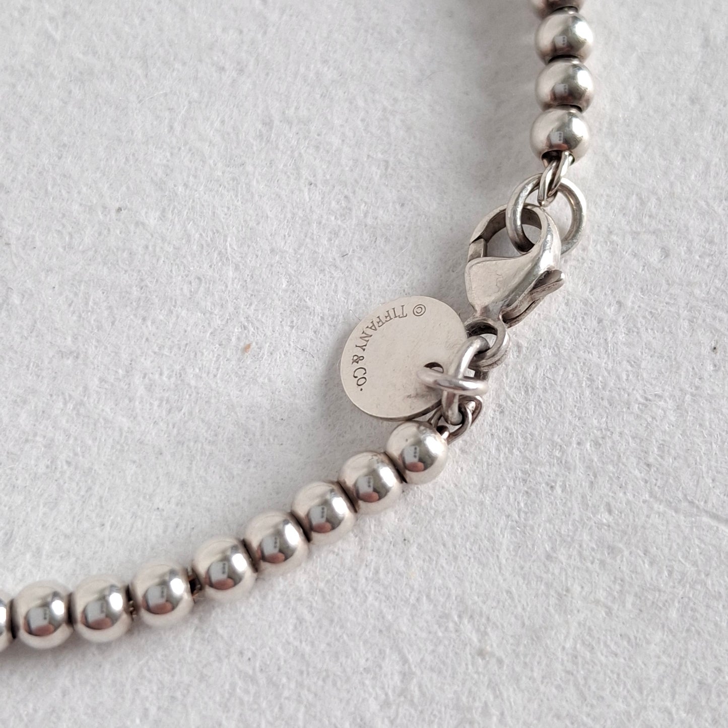 Return to Tiffany & Co 3mm Bead Bracelet with Mini Heart Padlock  Charm