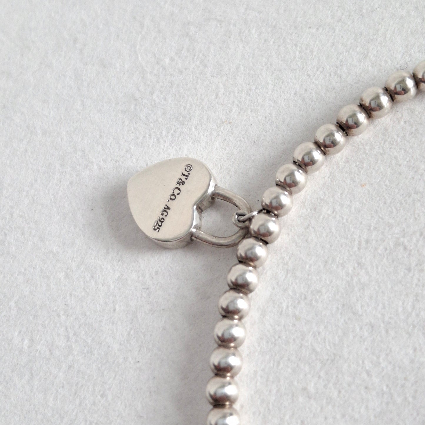 Return to Tiffany & Co 3mm Bead Bracelet with Mini Heart Padlock  Charm