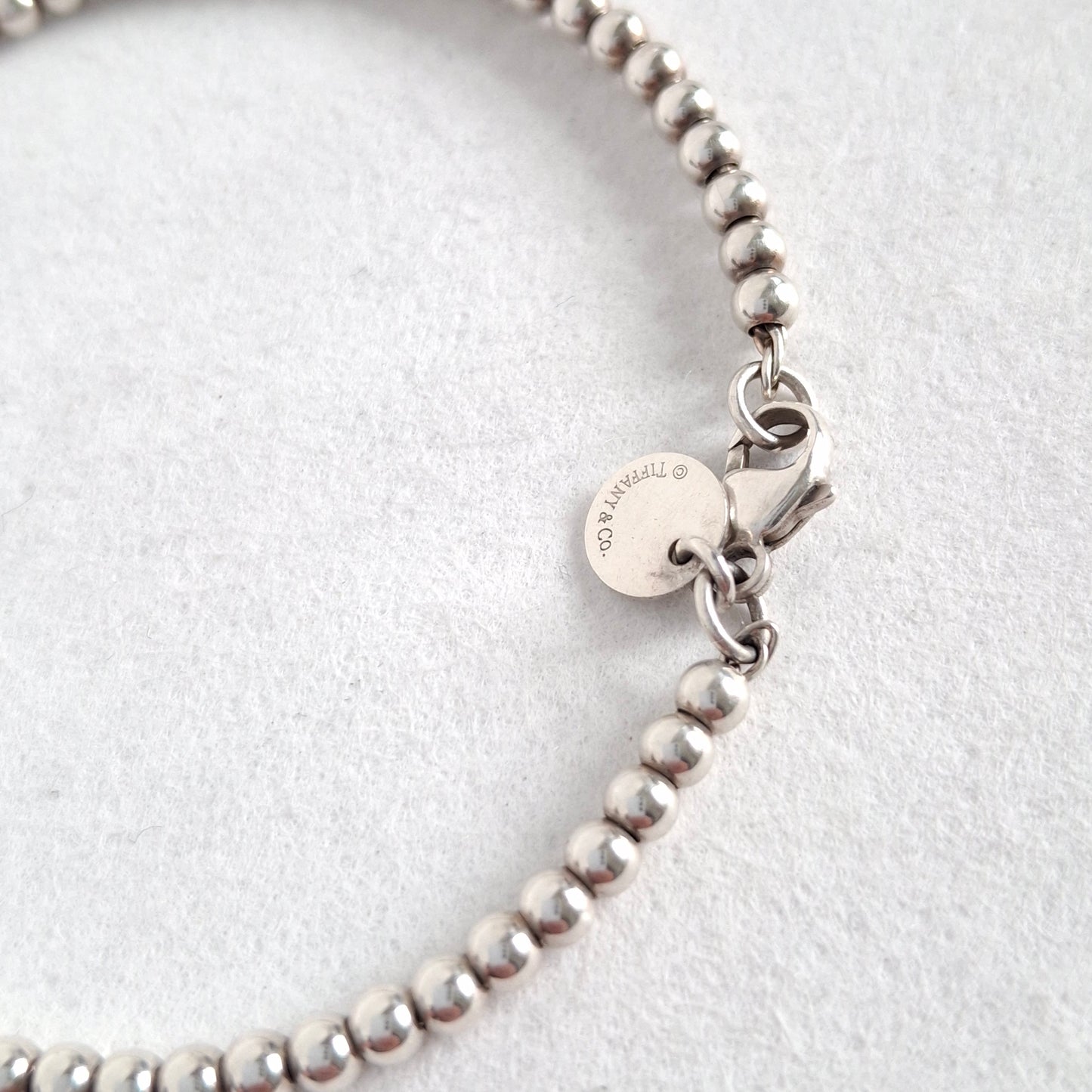 Return to Tiffany & Co 3mm Bead Bracelet with Mini Heart Padlock  Charm