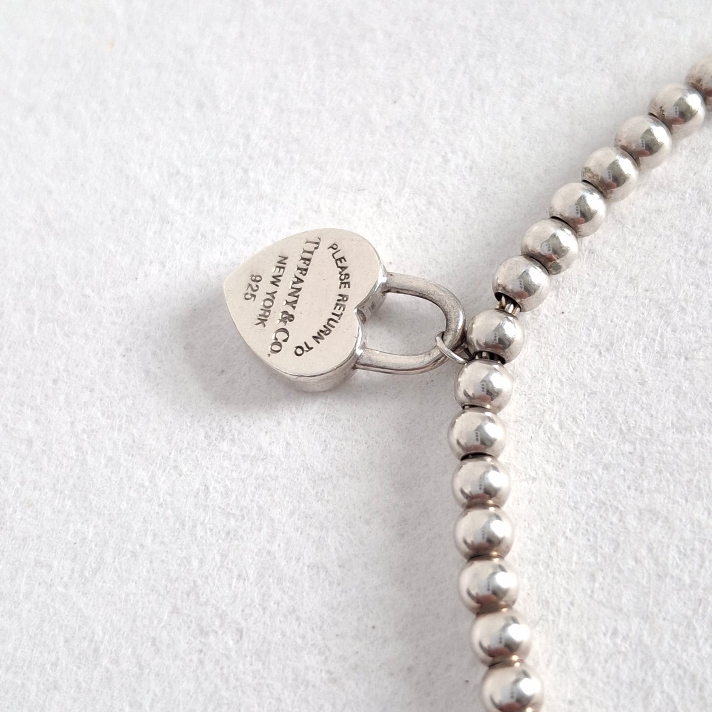 Return to Tiffany & Co 3mm Bead Bracelet with Mini Heart Padlock  Charm