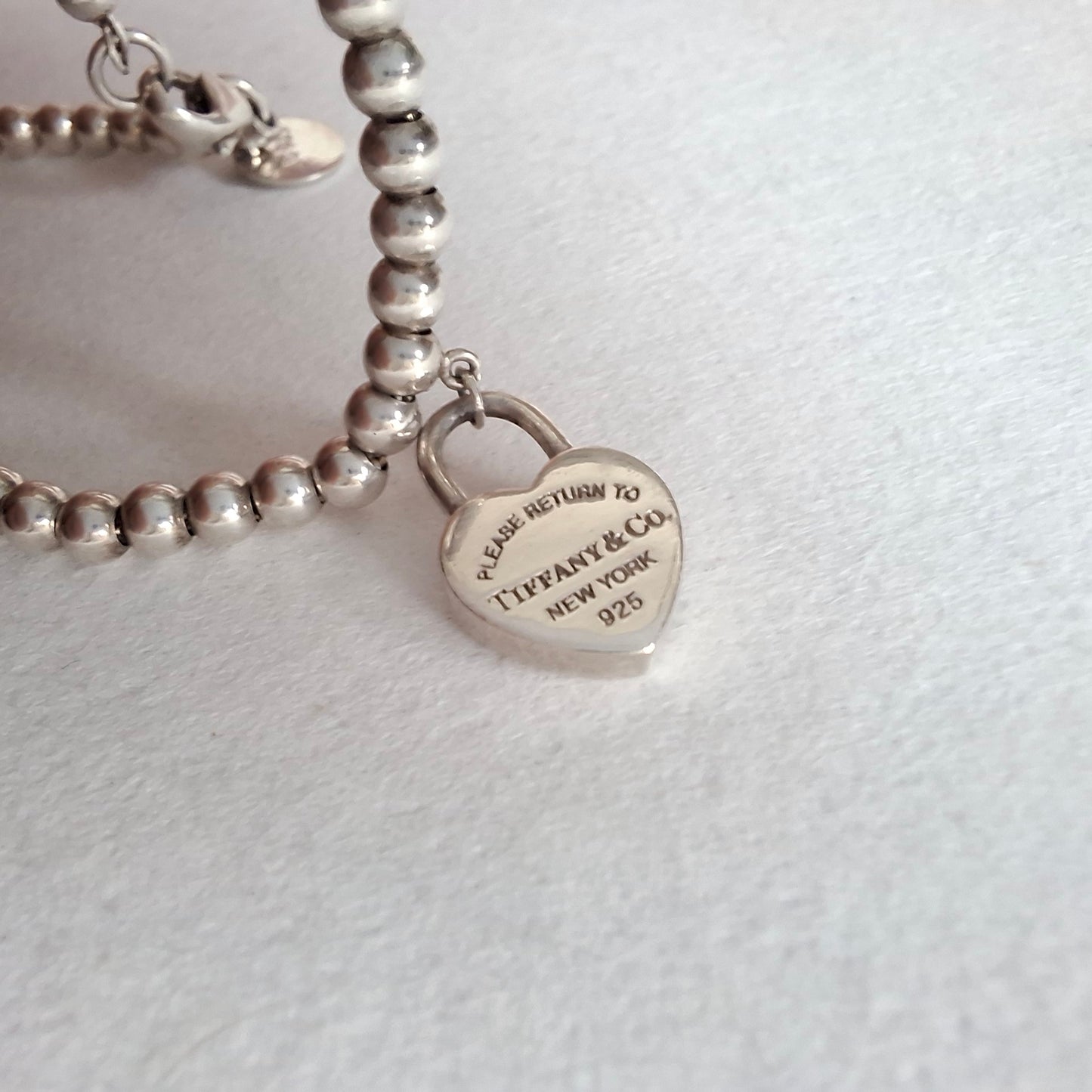 Return to Tiffany & Co 3mm Bead Bracelet with Mini Heart Padlock  Charm