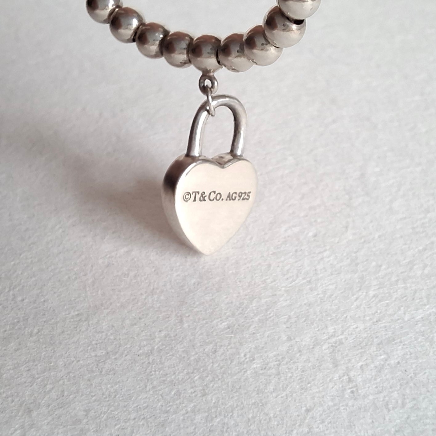 Return to Tiffany & Co 3mm Bead Bracelet with Mini Heart Padlock  Charm