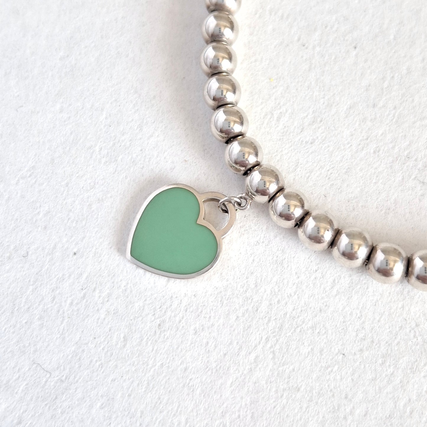 Return to Tiffany & Co 3mm Bead Bracelet with 10mm Blue Enamel Heart Charm in Sterling Silver
