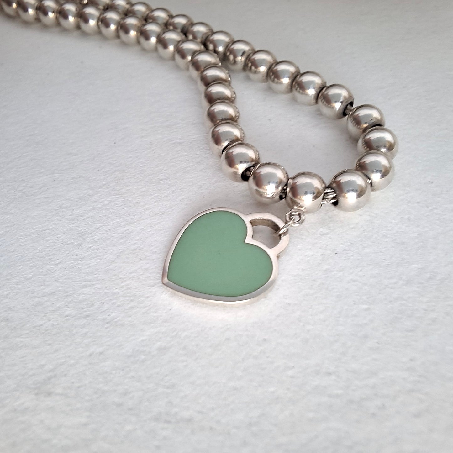 Return to Tiffany & Co 3mm Bead Bracelet with 10mm Blue Enamel Heart Charm in Sterling Silver