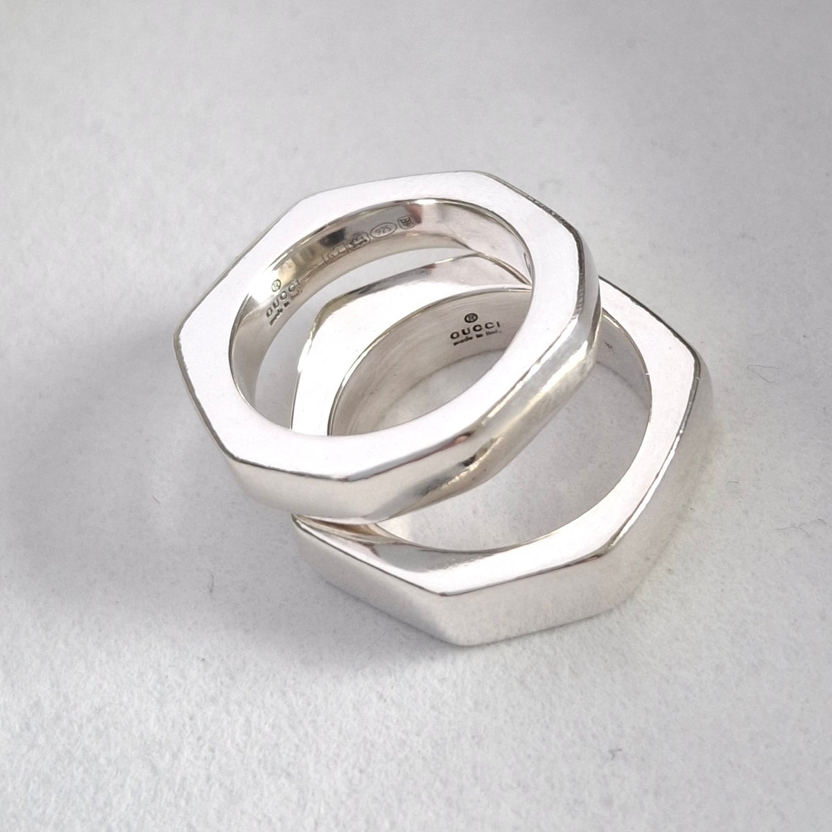 A Pair of Sterling Silver Gucci Hex Stacking Rings with Pouch and Box