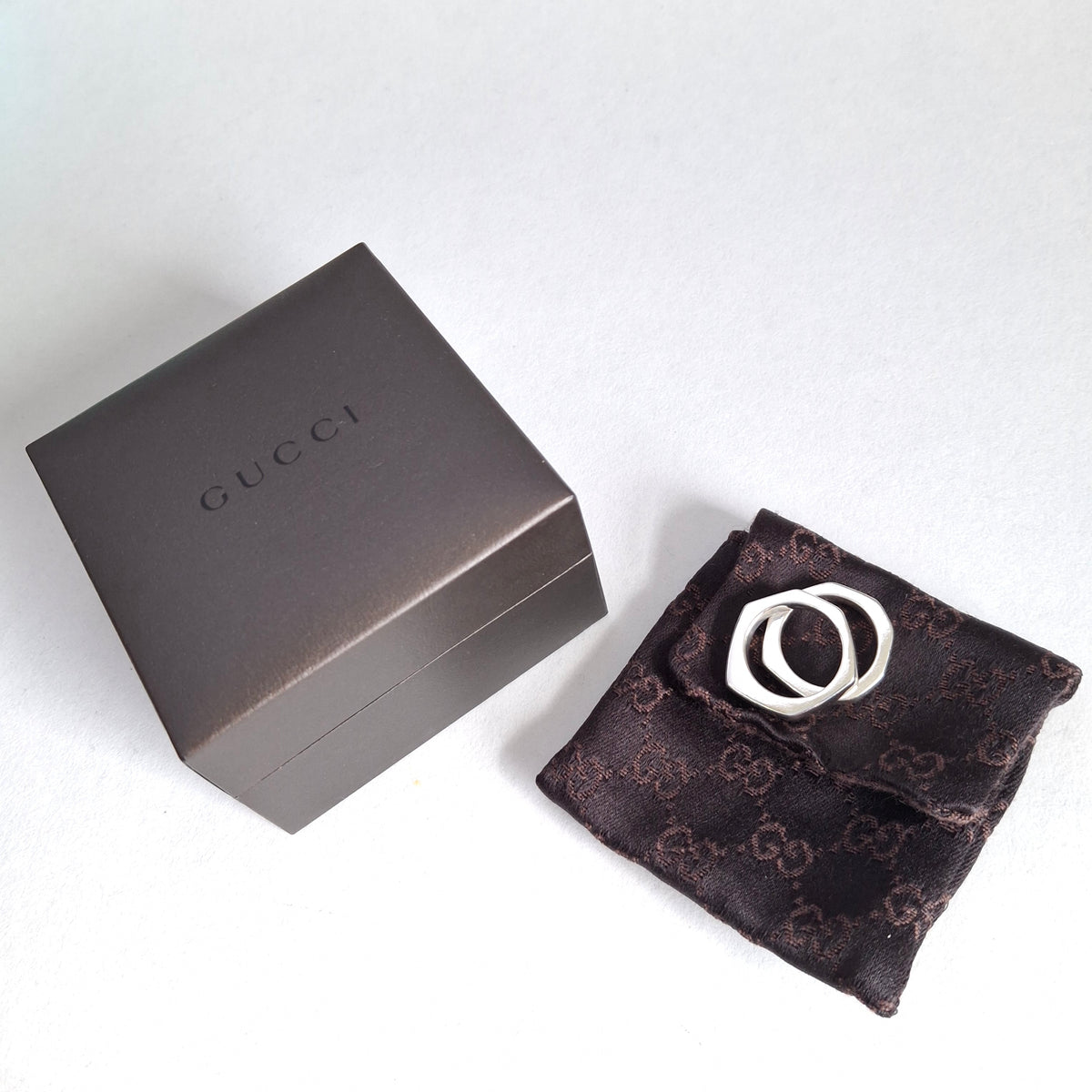 A Pair of Sterling Silver Gucci Hex Stacking Rings with Pouch and Box