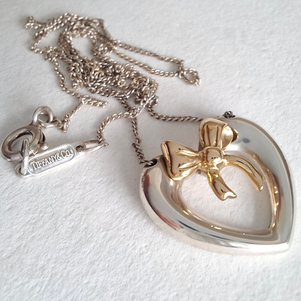 Vintage Tiffany & Co Sterling Silver Love Heart Pendant Necklace Inset with 18k Gold Ribbon Bow