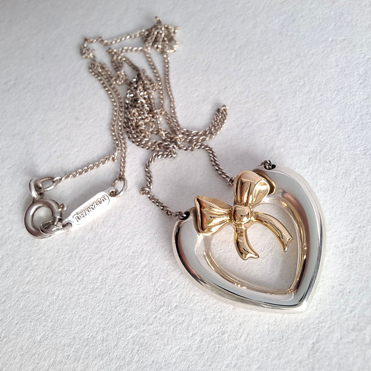 Vintage Tiffany & Co Sterling Silver Love Heart Pendant Necklace Inset with 18k Gold Ribbon Bow