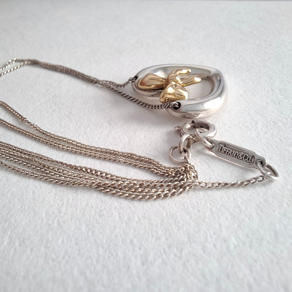 Vintage Tiffany & Co Sterling Silver Love Heart Pendant Necklace Inset with 18k Gold Ribbon Bow